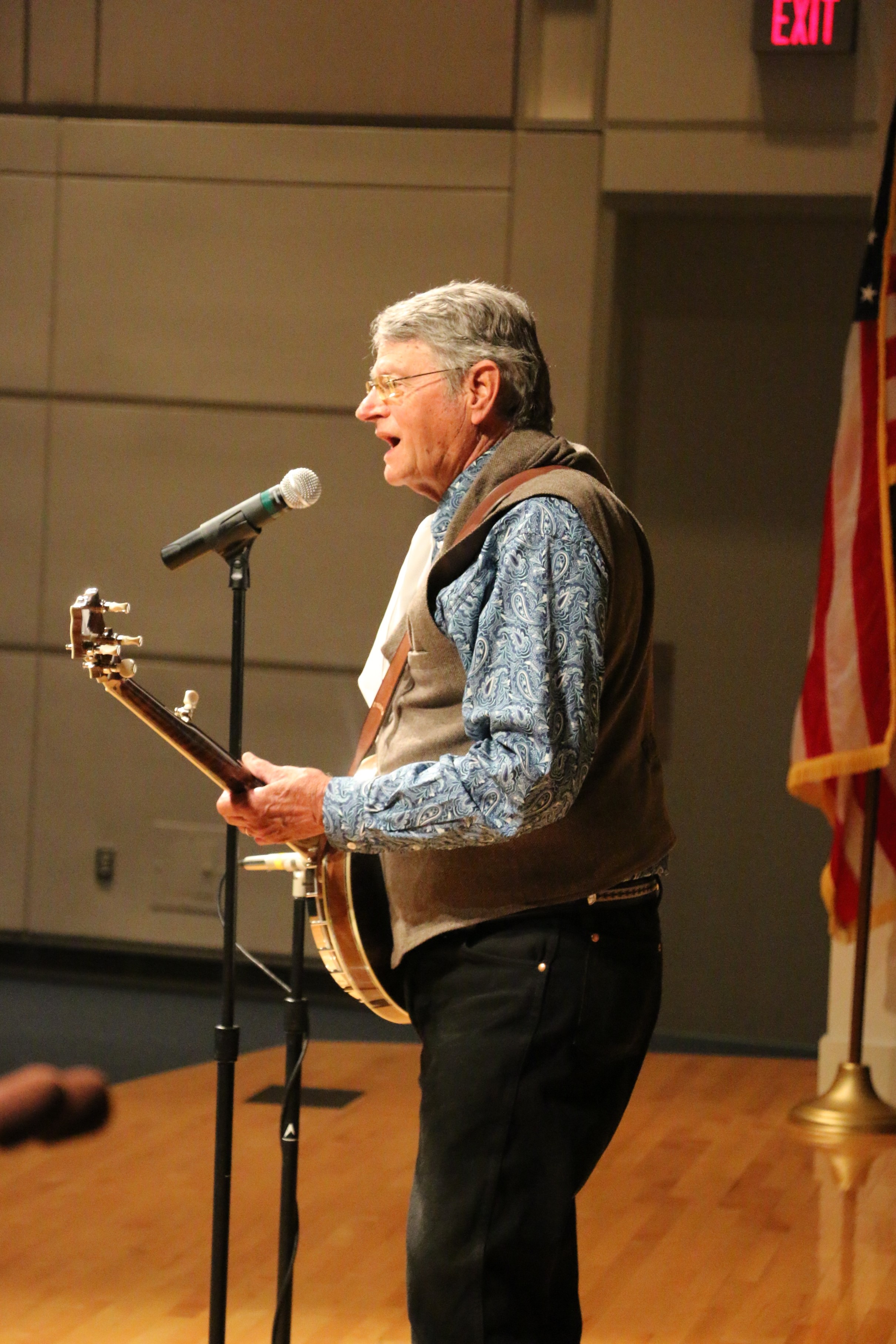 John Erickson playing banjo on stage