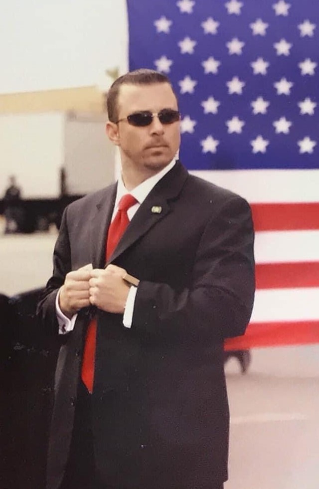 Michael Hecht portrait in front of U.S. flag